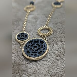 Goergoeus Gold tone and navy blue long necklace